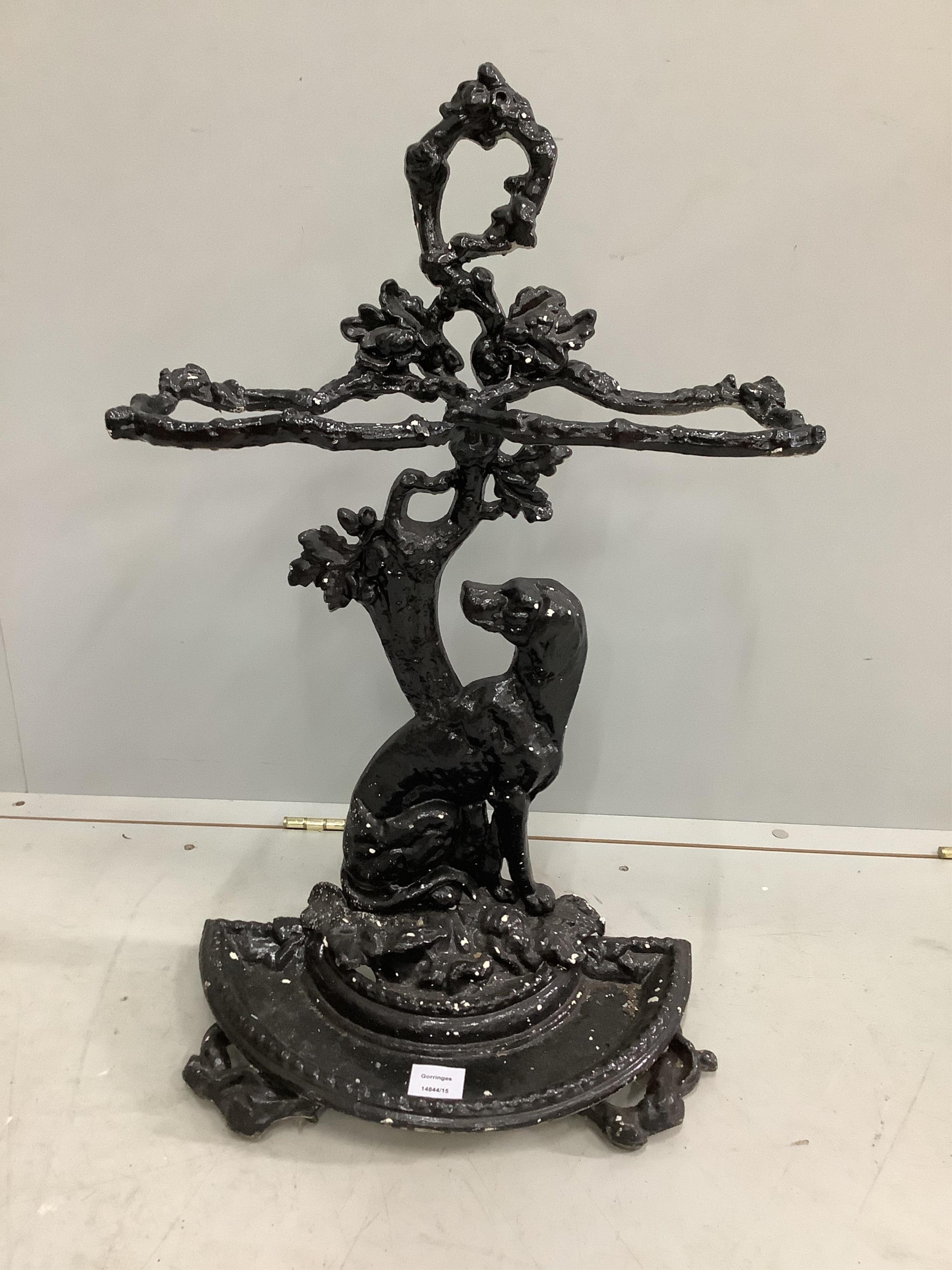 A Victorian cast iron stick stand, width 42cm, height 72cm. Condition - fair